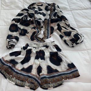 Cheetah set or can be sold separately. It’s a tie top with the matching shorts.